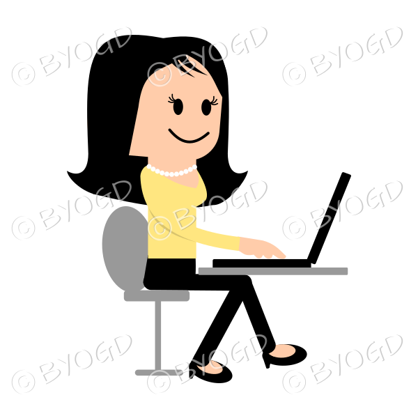 Girl in yellow sitting at laptop computer