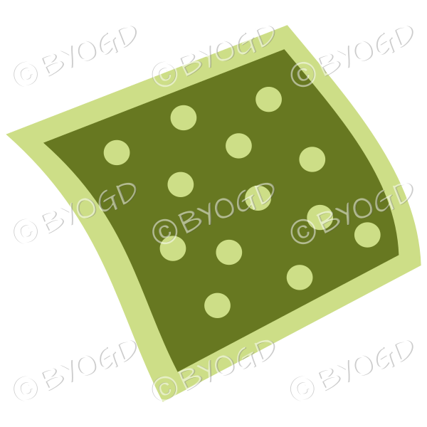 A green napkin or pillow with polka dots