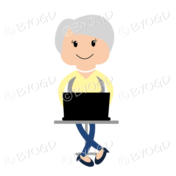 Woman sitting at laptop computer in yellow and blue