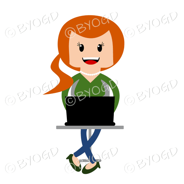 Woman sitting at laptop computer in green with long red/ginger hair